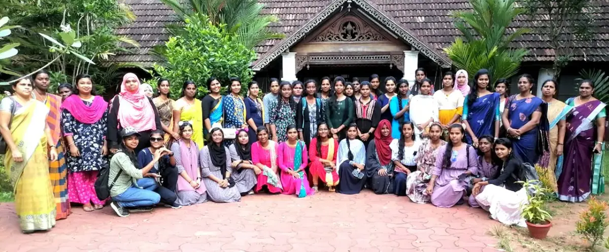 Students and staff of Muslim College of Education outside a heritage building